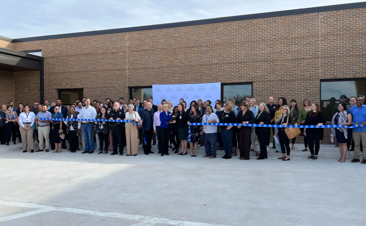 Members from Rock Springs, Williamson County, Bluebonnet Trails and others from the mental health task force cut a ribbon, opening the new adolescent wing called the Maple Unit. Photo courtesy of Williamson County. 