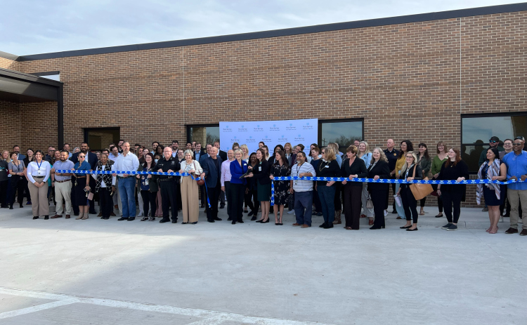 Members from Rock Springs, Williamson County, Bluebonnet Trails and others from the mental health task force cut a ribbon, opening the new adolescent wing called the Maple Unit. Photo courtesy of Williamson County.
