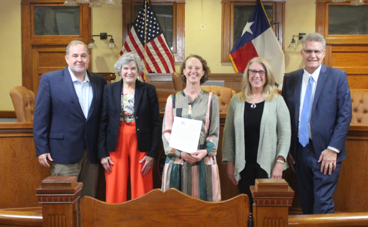 I Live Here I Give Here’s Executive Director Piper Stege Nelson, center, stands with the Williamson County Commissioner's Court after reading the proclamation making March 6-7 Amplify Wilco Days during the February 27 court meeting. Photo courtesy of Williamson County.
