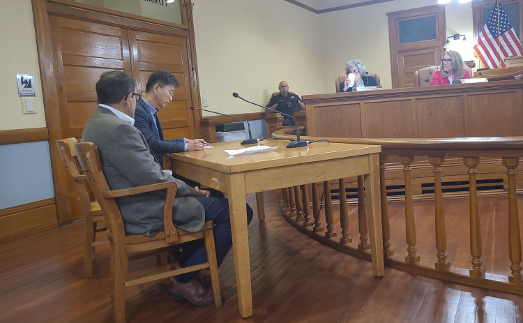 Simon Lee introduces himself and his company, Hanwha Advanced Materials America, LLC, at the March 19 Commissioners Court meeting. Hanwha is an automotive manufacturer based in South Korea. Photo by Nalani Nuylan.
