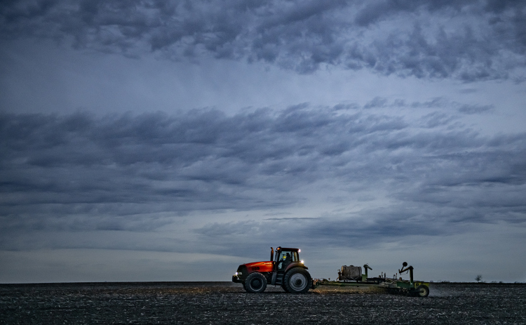 With his night lights shining, a farmer works a field along F.M. 619 a little north of U.S. 79  on Wednesday, February 28.    Photo by Andy Sharp