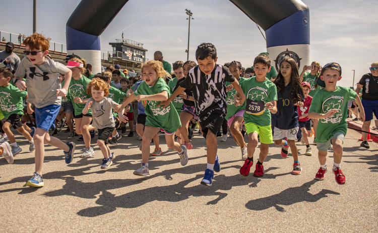 Participants take off from  the starting line in  the Fun Run.