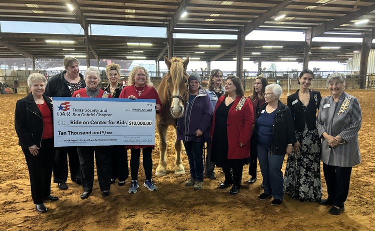 From left are Janis Keene, Carol Joiner, Brenda Kane, Regent Suzanne Jordan, Katherine Howell, Henry and Marcia Koenman from ROCK, Kathleen Davidson, Caroline Miller, Jennifer Williams, Judith Willard, Vanessa Buzgheia and Carole Lowe.  Photo courtesy of Ride On Center for Kids.
