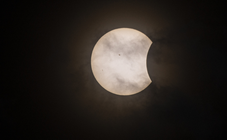 The moon's shadow moves onto the sun about 12:30p.m.  on Monday, April 8, 2024, during a total eclipse. Photos by Andy Sharp