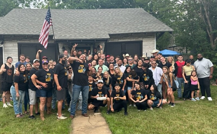 Levi Drake Rodriguez, standing front and center, celebrates at his Georgetown home after being selected in the NFL draft Saturday, April 27.
