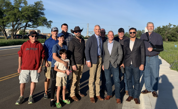 Officials gather to celebrate the opening of the newly conjoined roads of Verde Vista Drive and Williams Drive. From left are Hank Tovar, vice president of Heritage Oaks HOA, representatives from Culvers, Assistant City Manager Nick Woolery, Council Member Kevin Pitts, Mayor Josh Schroeder, Travis Wilkes, Kris Johnston and representatives from Savvy Development and Dexter Harmon, president of Heritage Oaks HOA. (Kaitlyn Wilkes)