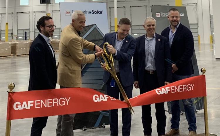 From left, Standard Industries Co-CEO David Winter, Mayor Josh Schroeder, Ralph Robinett and Martin DeBono from GAF Energy, and Standard Industries Co-CEO David Millstone cut the ribbon signifying the opening of the manufacturing facility. (Kaitlyn Wilkes)