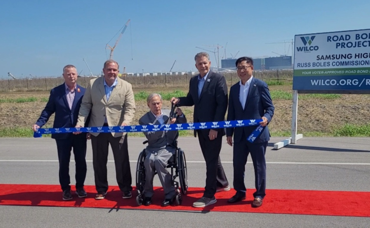 From left to right, TxDOT Engineer Tucker Ferguson, County Commissioner Russ Boles, Governor Greg Abbott, County Judge Bill Gravell and President of the Samsung construction team Dr. CH Park pose to cut the ribbon opening the Samsung Highway.