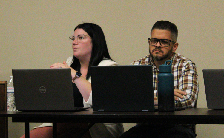 Jarrell’s Director of Planning and Development Jordan Cantu, left, is joined by City Engineer Jorge Hernandez, right, to discuss agenda items during the July 2 city council meeting. Photo by Nalani Nuylan.