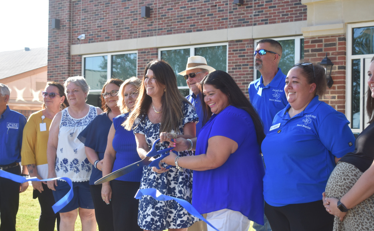Jarrell ISD board President Crystal Phalen (left) and Vice President Jenny Arnold cut the ribbon officially opening the new 1916 Building on August 21.