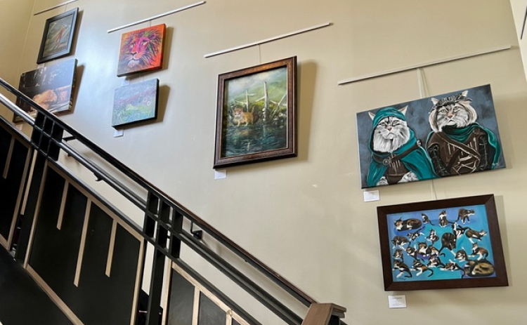 Artwork by WCAG artists on display in the Palace Theatre lobby during the production of “Cats.”