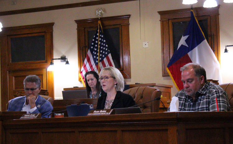 County Commissioner Valerie Covey, center, explains her reason for adding personnel to handle Child Protective Services cases in Williamson County during the September 17 meeting. Photo by Nalani Nuylan.