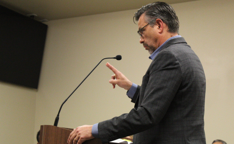 Williamson County Tax Assessor/Collector Larry Gaddes appears at Jarrell City Council to explain the potential effects if the city council passes the tax rate on September 30. Photo by Nalani Nuylan.