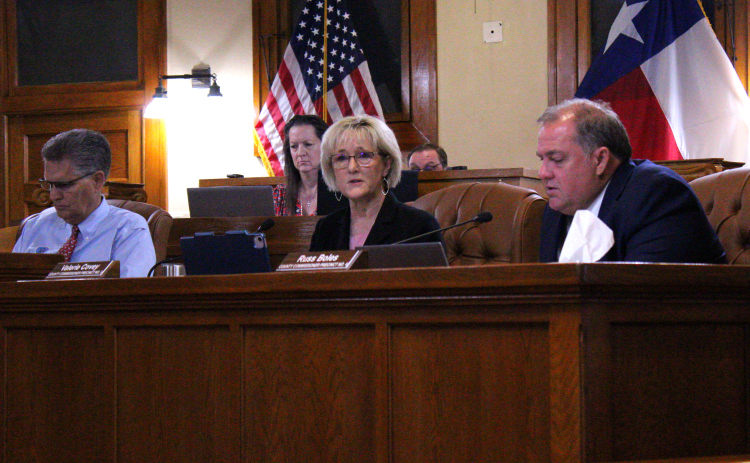 Commissioner Valerie Covey, center, explains the need for a Program Manager for the Justice Center project during the October 22 meeting. Photo by Nalani Nuylan.