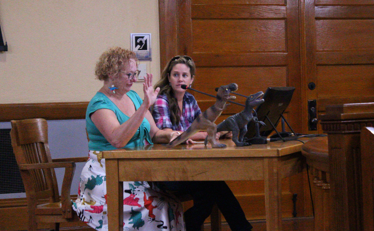 Kimberly Keller, left, advocates for Arterial K to be moved away from Possum Creek during the October 22 Commissioners Council meeting.  Photo by Nalani Nuylan.