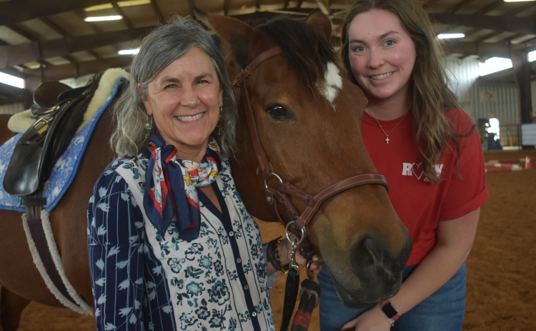 ROCK founder Nancy Krenek, left, and volunteer Gabby Guinn with Grant, an equine therapy-trained horse.