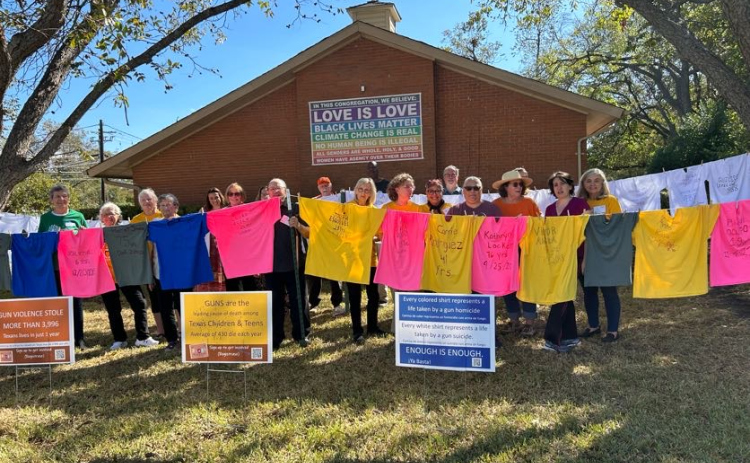 Members of the San Gabriel Unitarian Universalist Fellowship pose with the Vidas Robadas, or Stolen Lives, installation. Photo courtesy the San Gabriel Unitarian Universalist Fellowship.