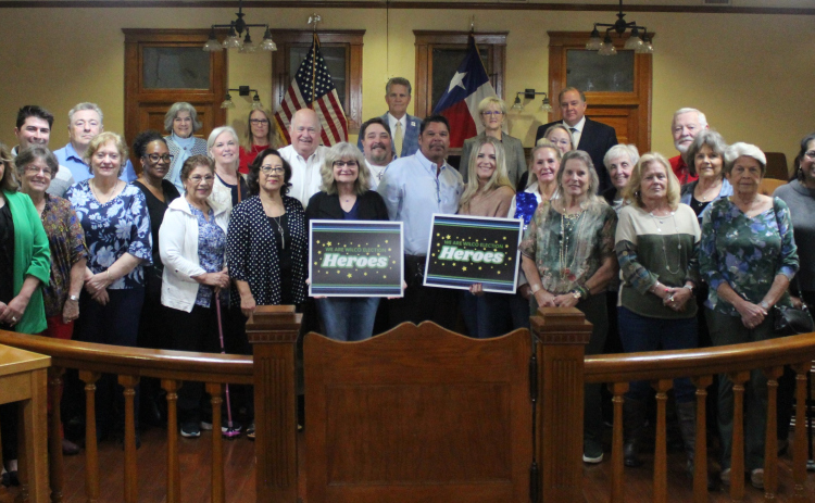 Election judges and clerks join Williamson County Party Chairs in the well of the Commissioners Courtroom. They were honored as election heroes. Photo courtesy of Williamson County.