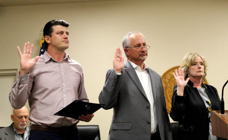 Mayor Patrick Sherek, left, Alderman Place 1 Daniel Klepac, center, and Place 2 Alderwoman Lori Allen take their oaths to serve November 19.