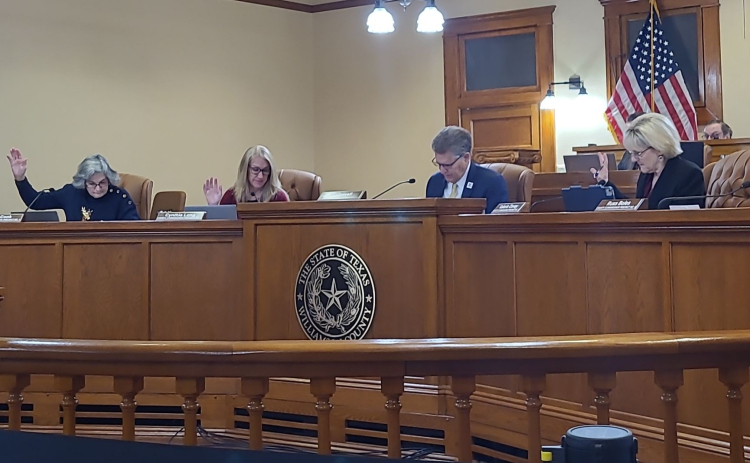 Williamson County Commissioners Terry Cook, Cynthia Long, County Judge Bill Gravell and Valerie Covey approve the funding for the construction improvements for RM 2243. Photo by Nalani Nuylan.