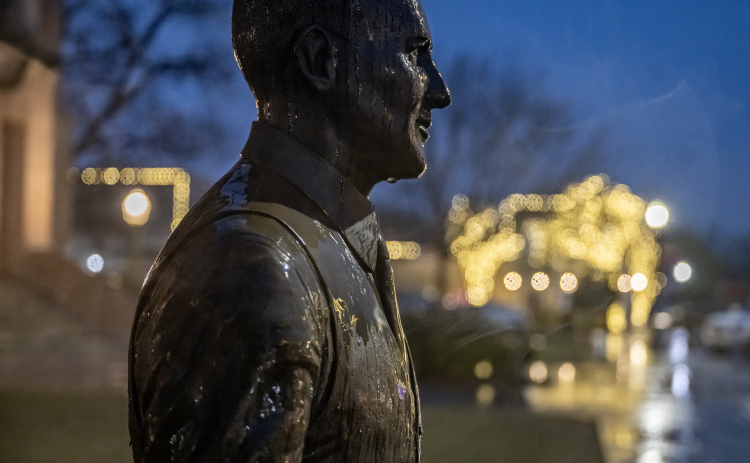 The statue of Dan Moody, a Taylor native who was Texas governor from 1927-1931, was covered in raindrops  on the Williamson County Courthouse lawn on a cold, wet and misty  Thursday, January 9, 2025.   Photo by Andy Sharp.