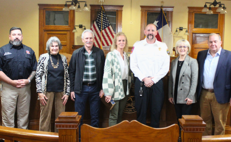 Mike Lugo, center, was sworn in as Williamson County’s new Fire Marshal, January 28. Commemorations of him are Bill Zito, director of Emergency Services (far left), County Commissioner Terry Cook, Mr. Lugo’s family, County Commissioner Valerie Covey and County Commissioner Russ Boles, far left. Photo by courtesy of Williamson County.
