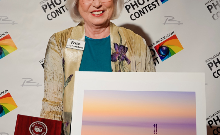 Rita Johnston stands with "Infinity View” and won a plaque in the Proficient Division.