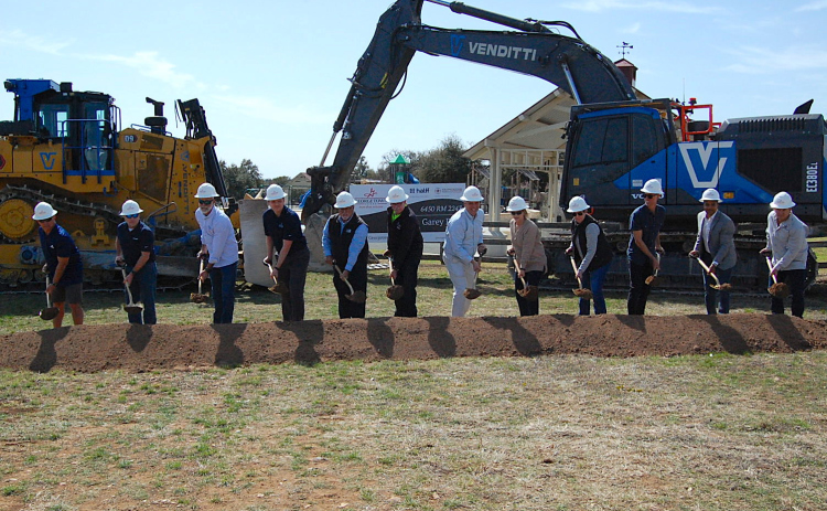 City Manager David Morgan, center, with Parks and Recreation Director Kimberly Garrett, right, and staff members from consulting firm Halff and construction company STR break ground at Garey Park on March 6. (Photo by Kaitlyn Wilkes)