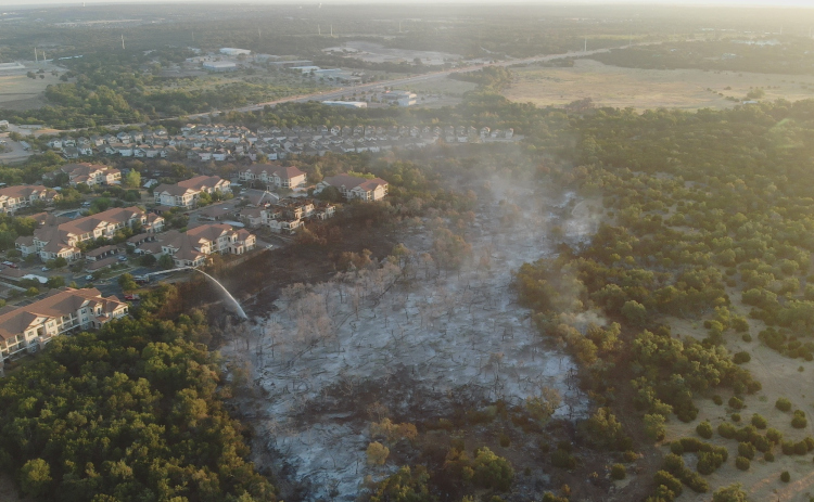 50 acres burnt near Parmer Lane: an overview shot shows an area in Cedar Park impacted by the Parmer Lane fire in August 2023. [Sun archive photo]