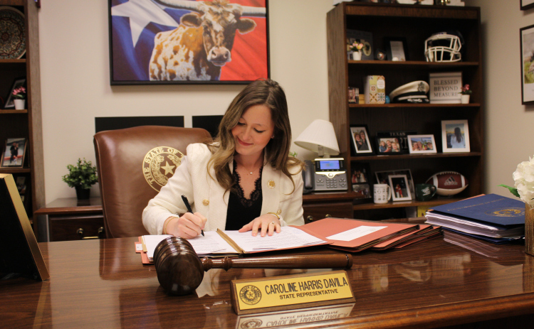 State Representative Caroline Harris Davila, R-Round Rock, works on House Bill 517, which deals with HOA fines, in her office at the Texas Capitol in downtown Austin, April 3. Photo by Nalani Nuylan.