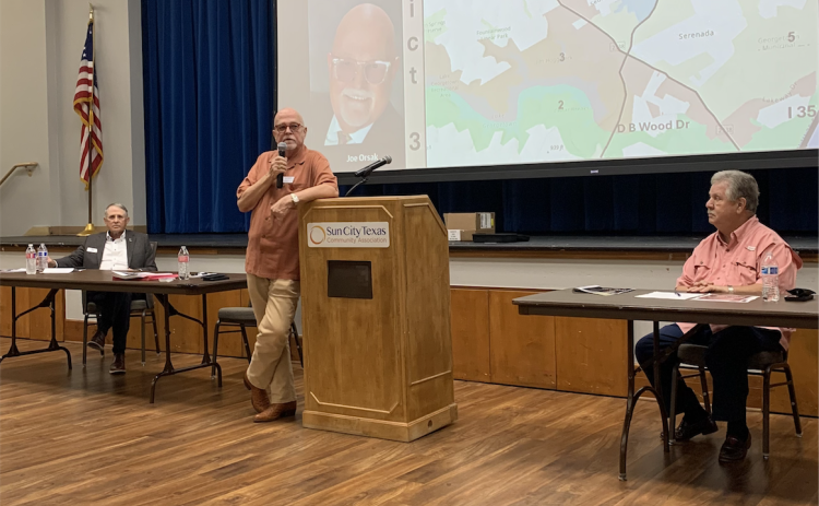 Joe Orsak, center, answers an audience question during the city council candidate forum on April 16. Mr. Orsak and Ben Butler, left, are running for District 3 and Ron Garland, right, is the incumbent for District 4. (Photo by Kaitlyn Wilkes)