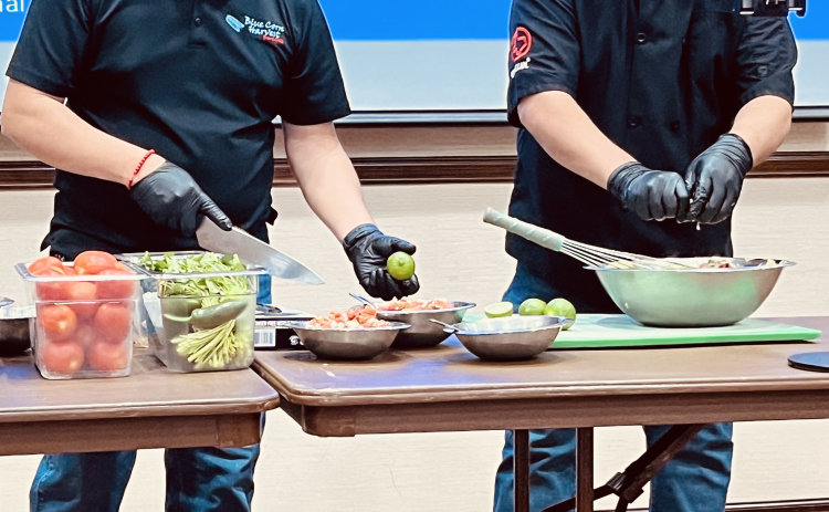 Carlos Manzano and Santos Garcia prepare Pico de Gallo.