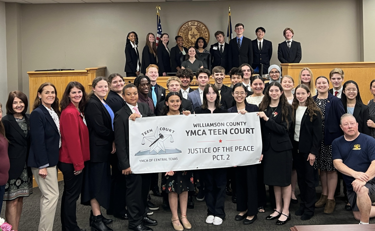 Fourth from the left front row: Justice of the Peace Precinct 2 Angela Williams. Far right front row: Former Justice of the Peace Precinct 2 Edna Staudt. Back row, middle in the judge's chair is Jasmine Wolf. Photo courtesy of Williamson County.
