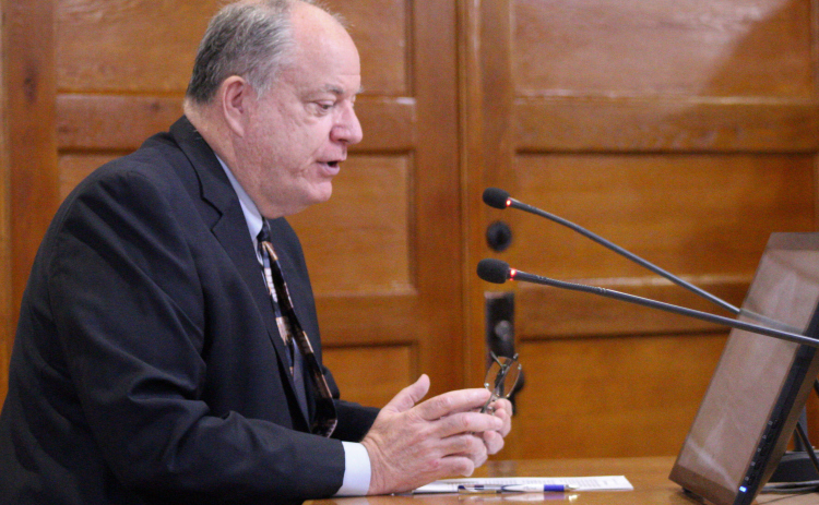 Senior Director of Infrastructure Bob Daigh explains why the Road and Bridge Department is asking for funding transfers for the Atlas 14 project. Photo by Nalani Nuylan.