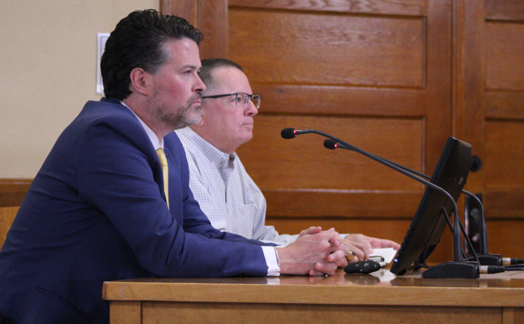 Cameron Glass, front, is joined by Jeff Bradley, behind, to answer questions about how Phase 1 of the new Jail/Justice Center project will roll out, July 22. Photo by Nalani Nuylan.