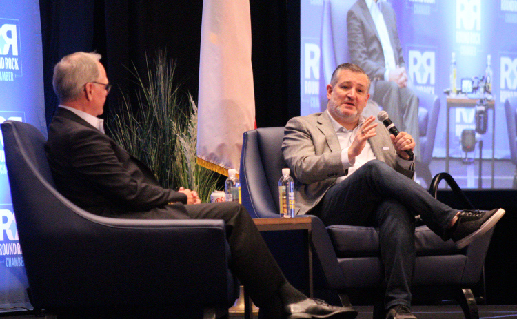 U.S. Senator Ted Cruz, right, speaks with John Howard, director of government affairs for Dell Technologies, left, during the Round Rock Chamber of Commerce's Power Lunch at Kalahari Resort and Convention Center on August 19. Photo by Nalani Nuylan.