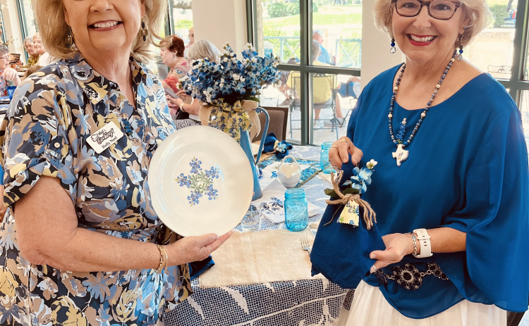 Holly Noel and Mary Jane Berry set a table.