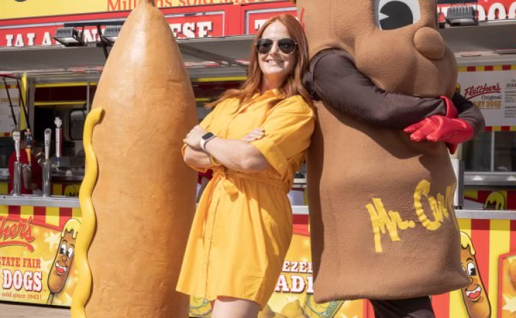 Fletcher’s co-owner Amber Fletcher with the company’s mascot Mr. Corny at the State Fair of Texas.  Photo courtesy Thomas Garza