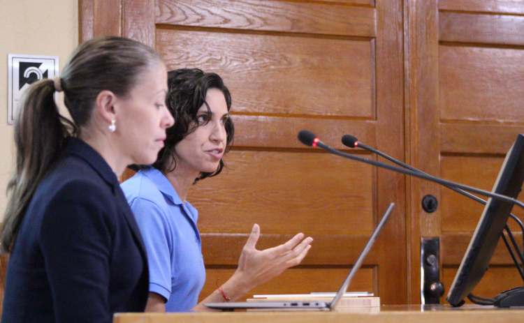 Misty Valenta, director of animal services for Wilco, back, is joined by Laura Donahue, senior director of Best Friends Animal Society, front, to report on the Williamson County Regional Animal Shelter’s success in 2024. Photo by Nalani Nuylan.