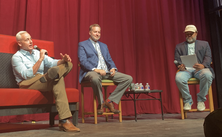 Georgetown Mayor Josh Schroeder, left, and County Judge Steven Snell, center, spoke about development in Georgetown and the county at a panel hosted by Glenn Hart, right. (Photo by Kaitlyn Wilkes)