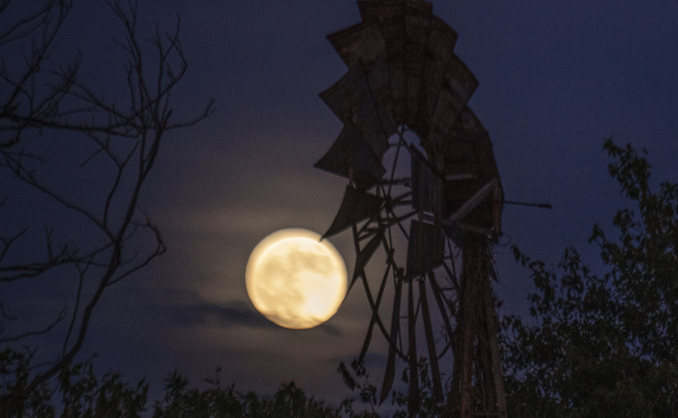 A full moon shines along County Road 345  on Monday, October 6, 2025.   Photo by Andy Sharp.