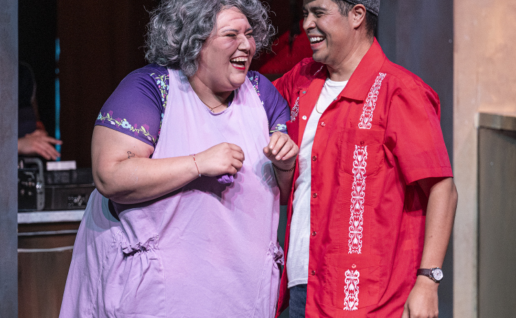 Gina Marie, as Abuela Claudia, and Daniel Ponce, playing Usnavi, are pictured in a scene from the Thursday, October 2, 2025 dress rehearsal for “In the Heights,” playing on the Palace Springer Stage through November 2nd.  Photo by Andy Sharp.