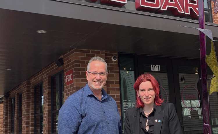 General Manager Dale Peake, left, and head sommelier Kaitlyn Pearson stand outside of Körk Wine Bar located on the Square near the Grace Heritage Center. (Photo by Kaitlyn Wilkes)