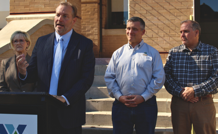 County Judge Steve Snell, center, announces the plan for the Williamson County Water Study, November 25. Photo by Nalani Nuylan.