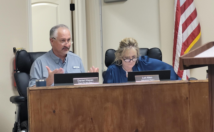 Mayor Pro Tem/Alderman Place 1 Daniel Klepac, left, and Alderwoman Place 2 Lori Allen, right, ask questions on construction specifics during the November 4 Jarrell City Council meeting. Photo by Nalani Nuylan.