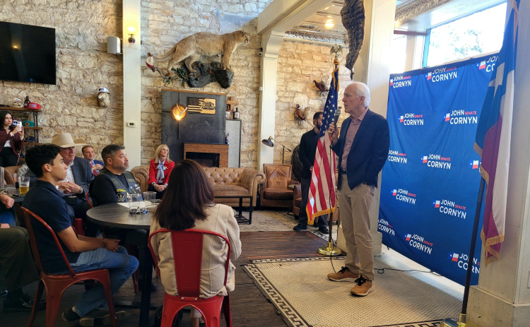 U.S. Senator John Cornyn, right, hosts a camping rally event at Mesquite Creek Outfitters on the Georgetown Square on Tuesday afternoon. Photo by Nalani Nuylan.