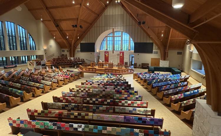 Handmade quilts are draped over the benches at Faith Lutheran Church in Georgetown.