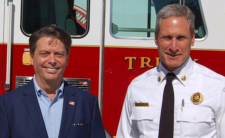 ESD 8 Commissioner Troy Rodriguez and Fire Chief John Sullivan stand in front of a fire engine. ESD 8 service residents in the City of Georgetown and its surrounding areas. (Photo by Kaitlyn Wilkes)