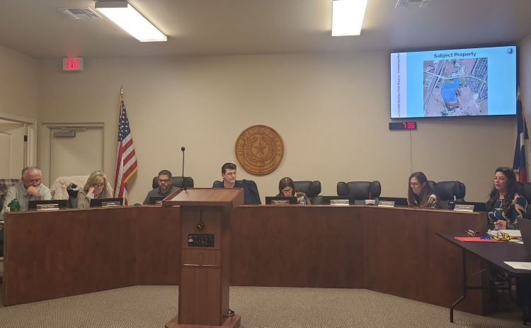 Jarrell City Council reviews the proposed property of the Cornhill Business Park during the December 1 meeting. From left: Daniel Klepac, Mayor Pro Tem/Alderman Place 1, Lori Allen, Alderwoman Place 2, City Manager Jorge Hernandez,  Mayor Patrick Sherek, Tanya Clawson, Alderwoman Place 3, Tammy Fitzner, Alderwoman Place 5, and Development Services Director Yvonne Spell. Photo by Nalani Nuylan.