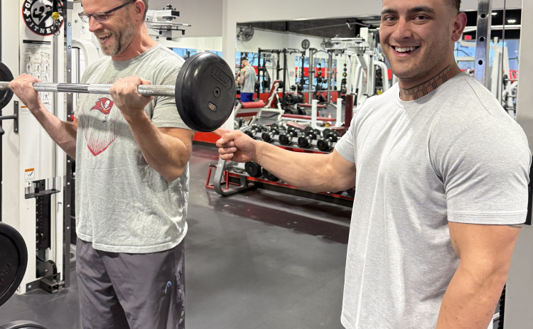 Morgan Mclaughin, left, works out with trainer Brennan Eggers at Georgetown Fitness.